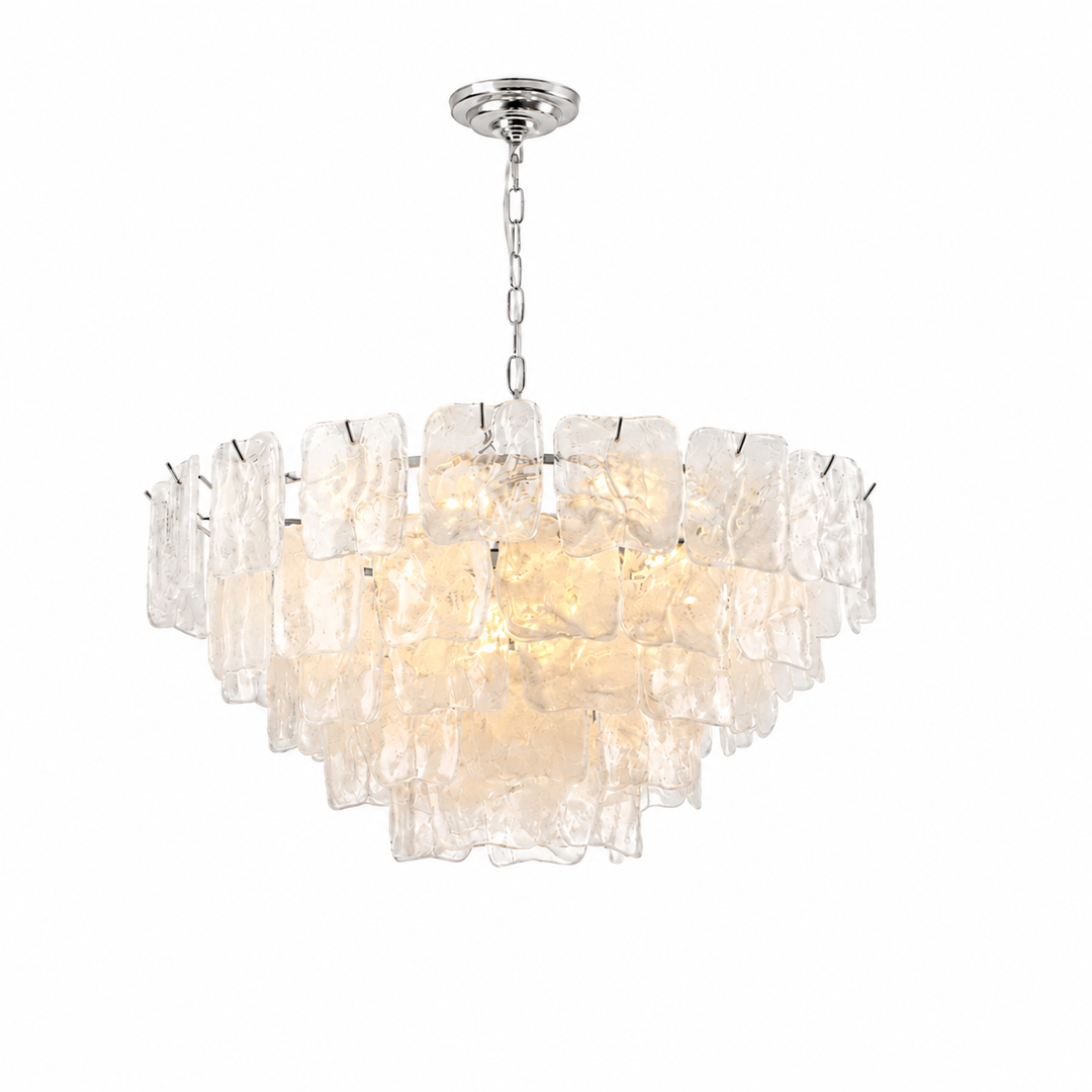 A modern tiered chandelier featuring textured clear glass shades and a polished silver-tone metal canopy and chain, shown against a solid white background.