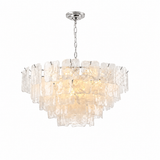 A modern tiered chandelier featuring textured clear glass shades and a polished silver-tone metal canopy and chain, shown against a solid white background.