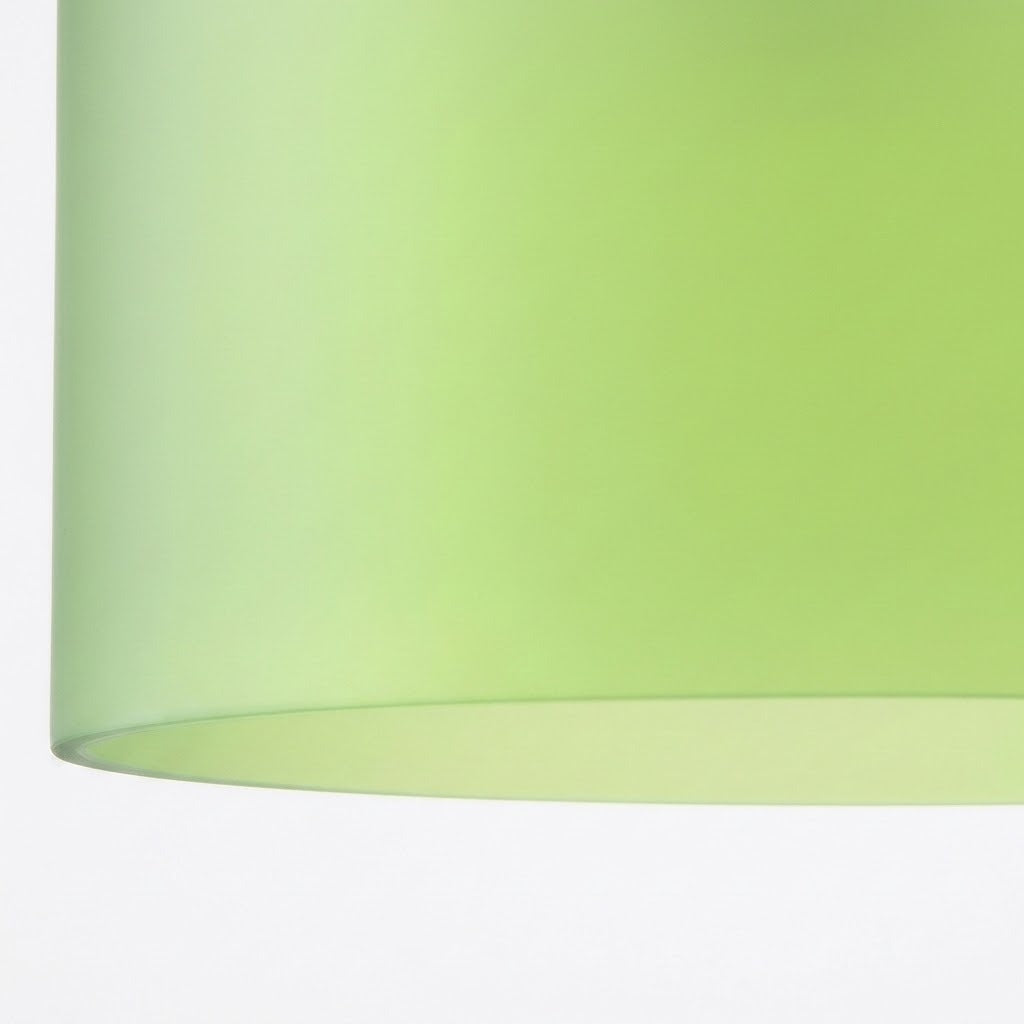 A close-up shows the curved lower rim and smooth light green glass shade of a chandelier against a white background.