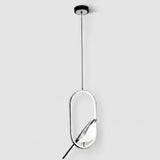 A modern pendant light fixture with a thin black suspension cord, a black circular ceiling canopy, and a large oval frame in polished silver metal. A clear glass shade is suspended inside the oval frame, reflecting the light.