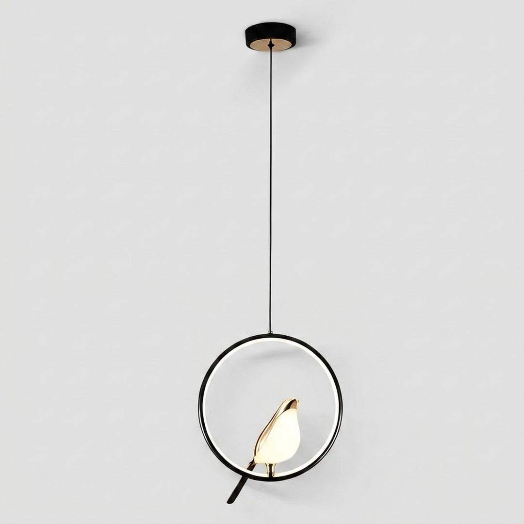 Modern pendant light with a black circular frame, a small bird-shaped bulb in the center, and a thin black hanging cord against a light gray background.