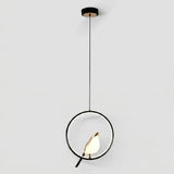 Modern pendant light with a black circular frame, a small bird-shaped bulb in the center, and a thin black hanging cord against a light gray background.