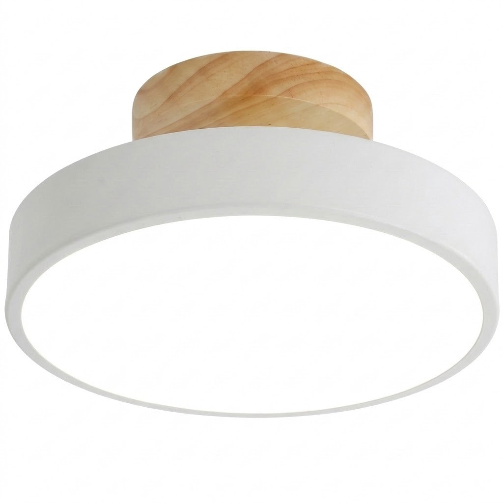 A modern flush-mount ceiling light featuring a wide white circular shade and a natural light-wood ceiling mount, shown against a plain white background.