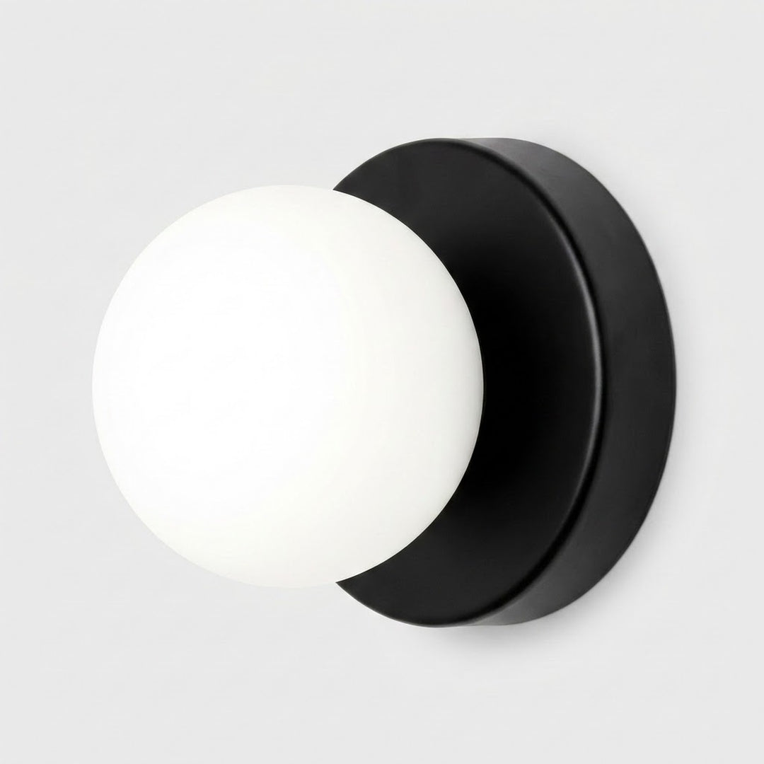 Wall sconce with a white plastic globe shade and black circular iron base against a light gray background.