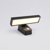 Black wall sconce with a broad illuminated rectangular panel and white motion sensor, shown at an angle against a light gray background.
