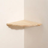 A light natural wood corner shelf mounted on two off-white walls, shown from an angled perspective.