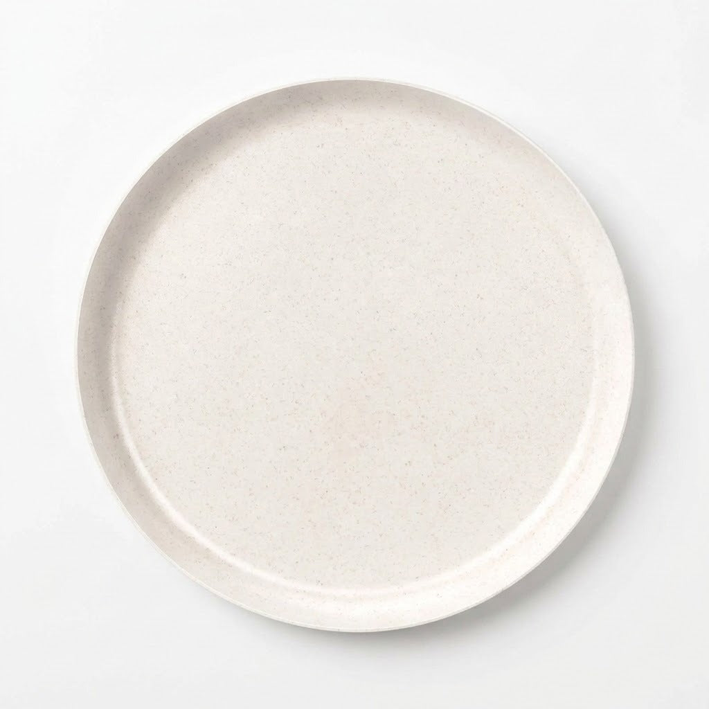 A round ceramic plate with a textured, speckled off-white finish, photographed from directly above on a clean white background.