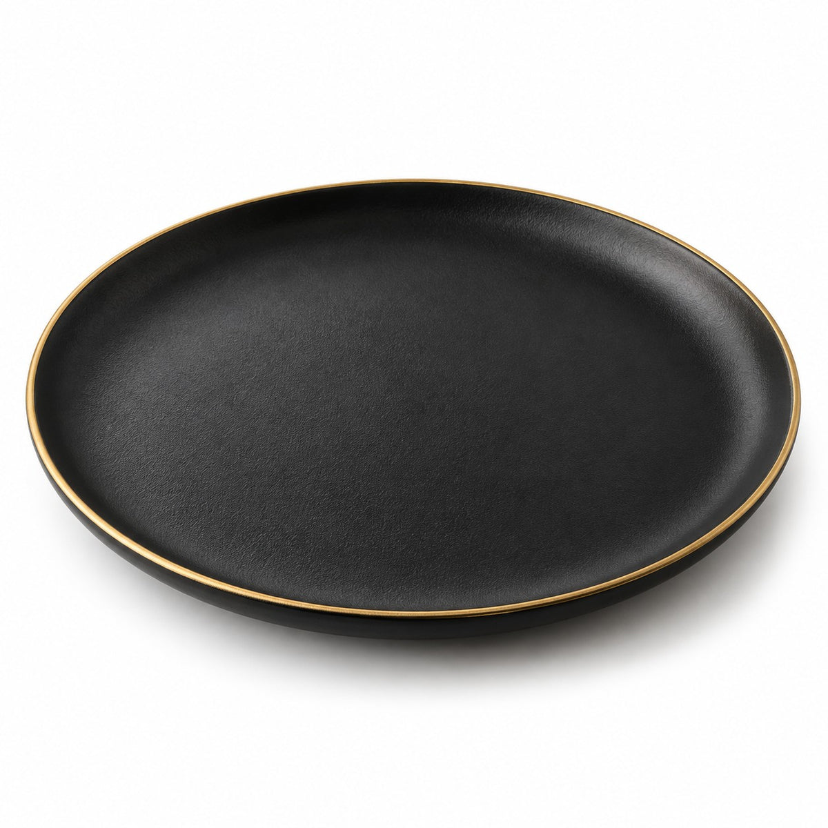 One matte black ceramic dinner plate with a thin gold rim isolated on a white background.