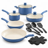 Slate Blue Ceramic Cookware Set includes blue pots and pans, glass lids, black utensils, and pan protectors.