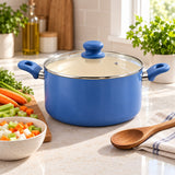 Slate Blue Ceramic Cookware Set stockpot sits beside chopped vegetables and a wooden spoon on a kitchen counter.