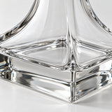 Close-up of the transparent thick glass and polished heavy base of the wine decanter.