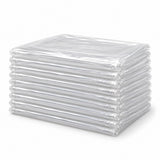 A neat stack of ten clear disposable plastic tablecloths shows the single-use covers included.