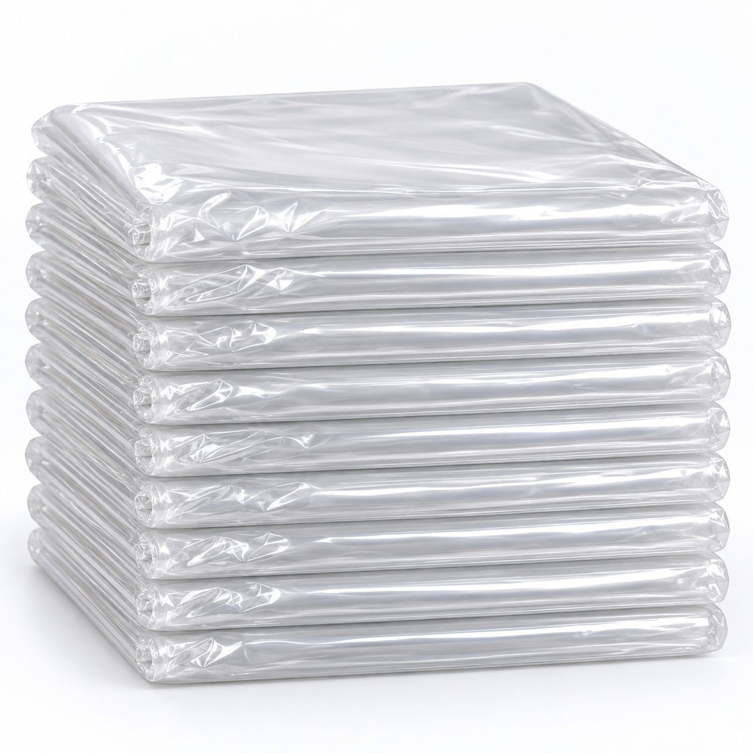 Set of 10 clear disposable plastic tablecloths folded in a compact stack on a pale backdrop.