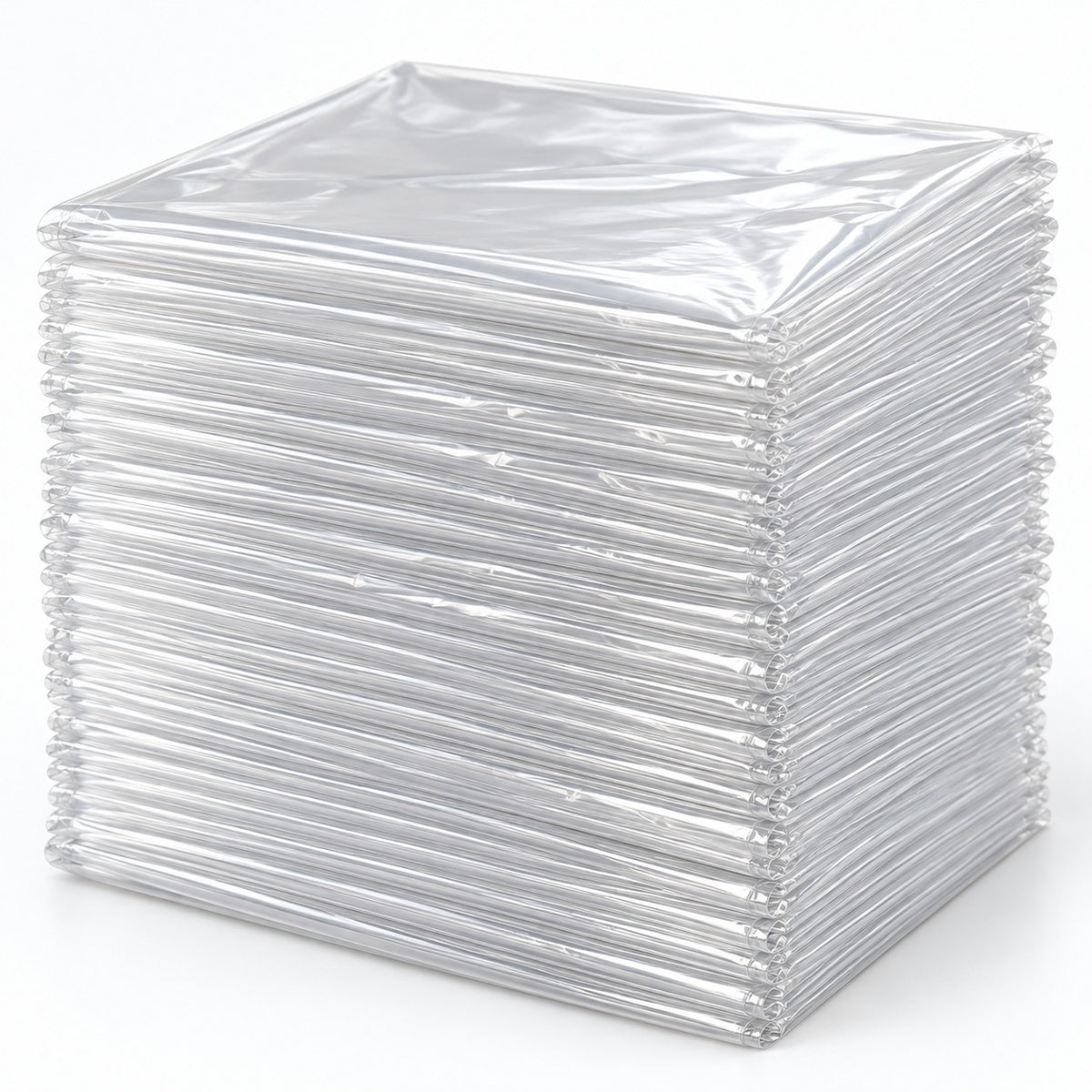 Set of 30 clear disposable plastic tablecloths folded in a thicker layered stack on a pale backdrop.