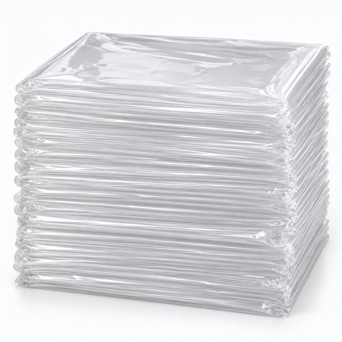 Set of 50 clear disposable plastic tablecloths folded in a substantial layered stack on a pale backdrop.