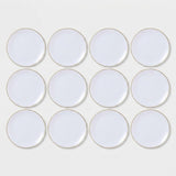 A set of twelve white round plates with a delicate gold rim, arranged in a neat 3x4 grid on a light gray background.