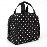 A black insulated lunch bag with a white polka dot pattern, featuring two top handles and a front zippered pocket, shown on a plain white background.