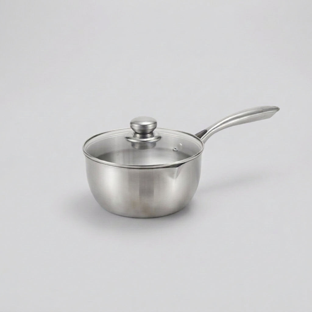A stainless steel saucepan with a glass lid and long handle, shown on a light gray background.