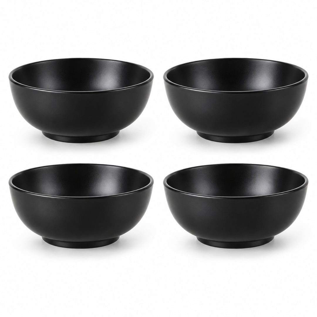Exactly four black Japanese-style bowls sit in a two-by-two arrangement on white.