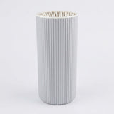 A light gray pleated cylindrical filter cartridge, likely for a humidifier or air purifier, shown against a plain white background.