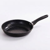 A black non-stick frying pan with a speckled interior and a black handle, shown on a clean white background.