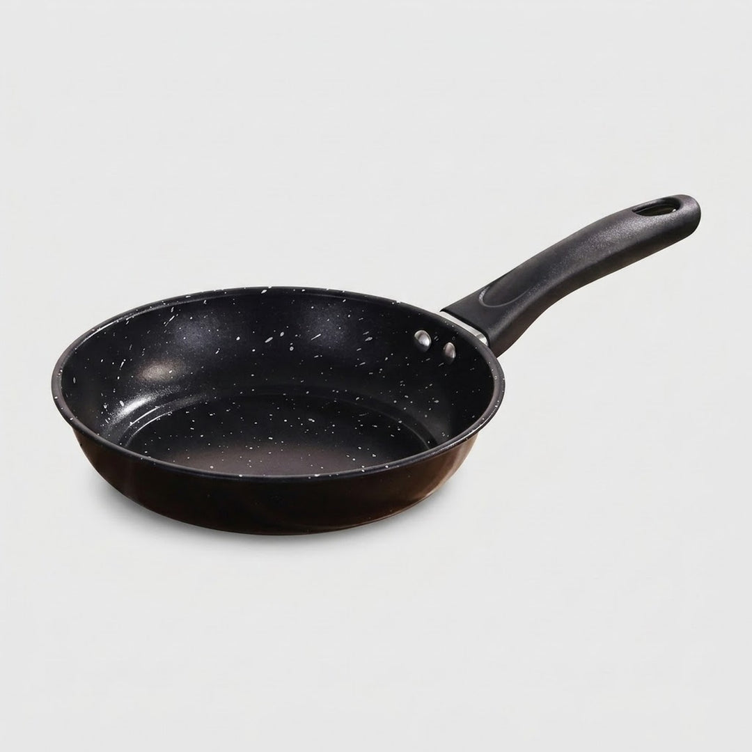 A black non-stick frying pan with a speckled interior and a matching black handle, shown on a light gray background.
