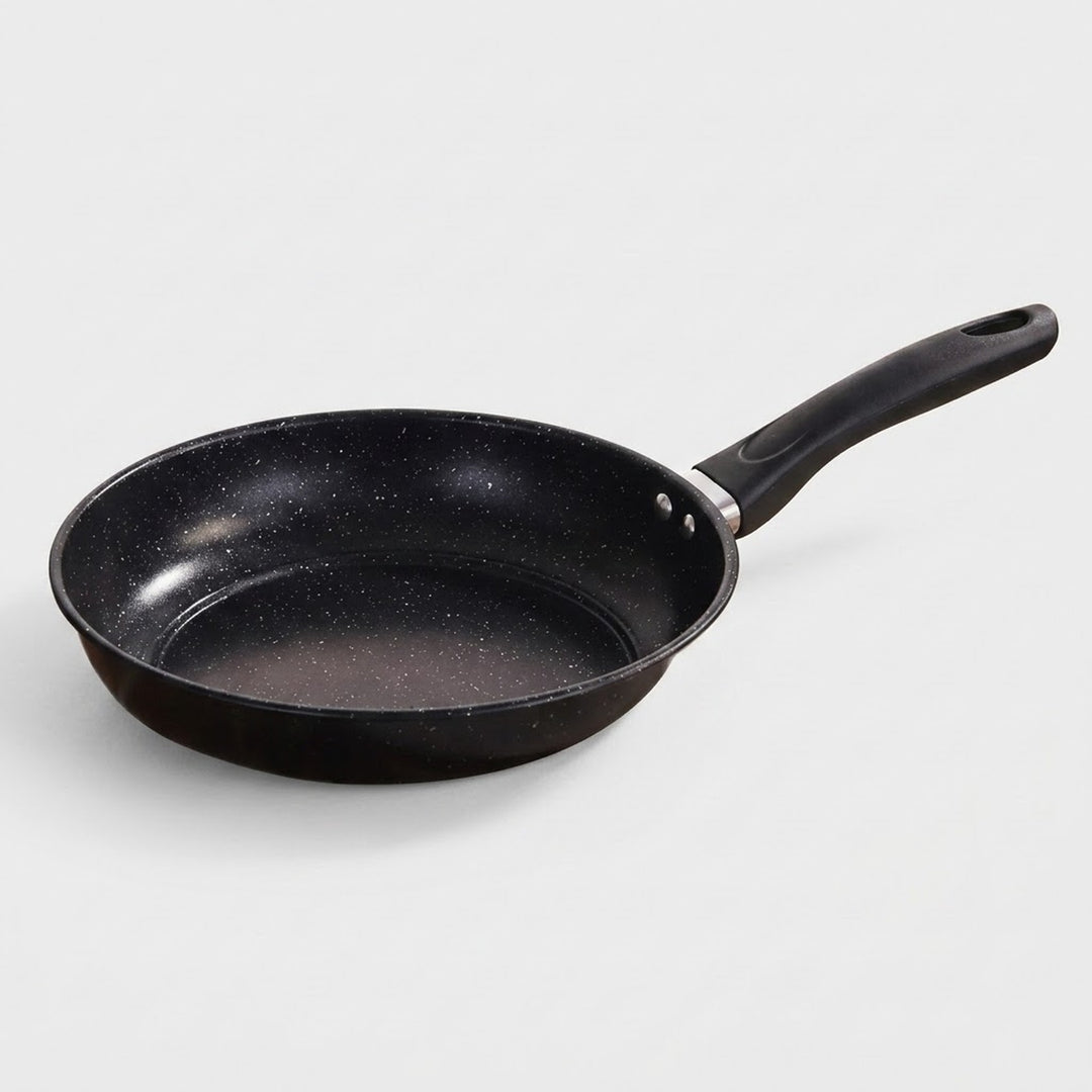 Black frying pan on a white background