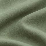 Close view of the sage green polyester tablecloth's fine woven texture and matte finish.