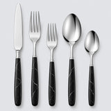 Black and silver five-piece flatware set with stainless utensils and veined black handles on gray.