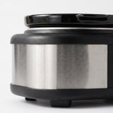 Close-up of a cylindrical stainless steel appliance or container with black plastic trim and base, photographed on a clean white background.
