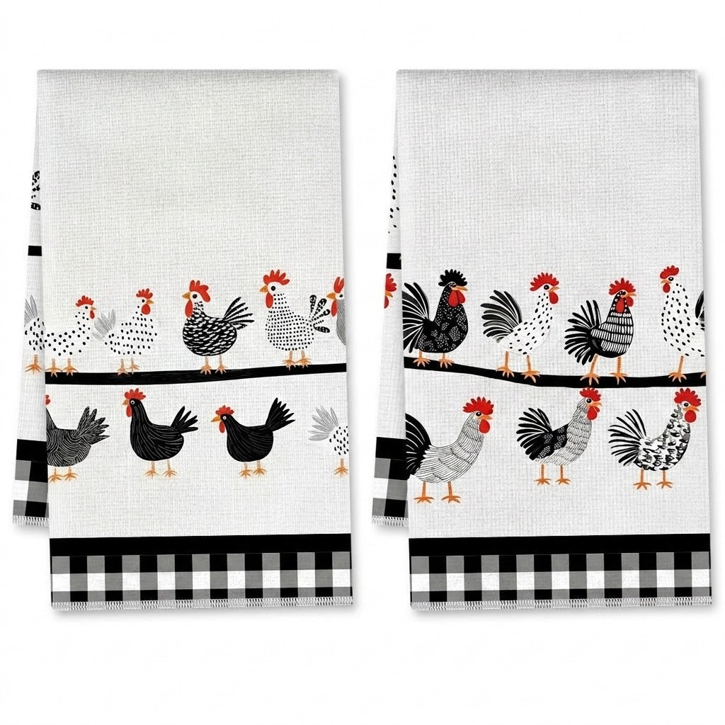 Two white kitchen towels with a black and white rooster pattern, displayed side by side against a white background.