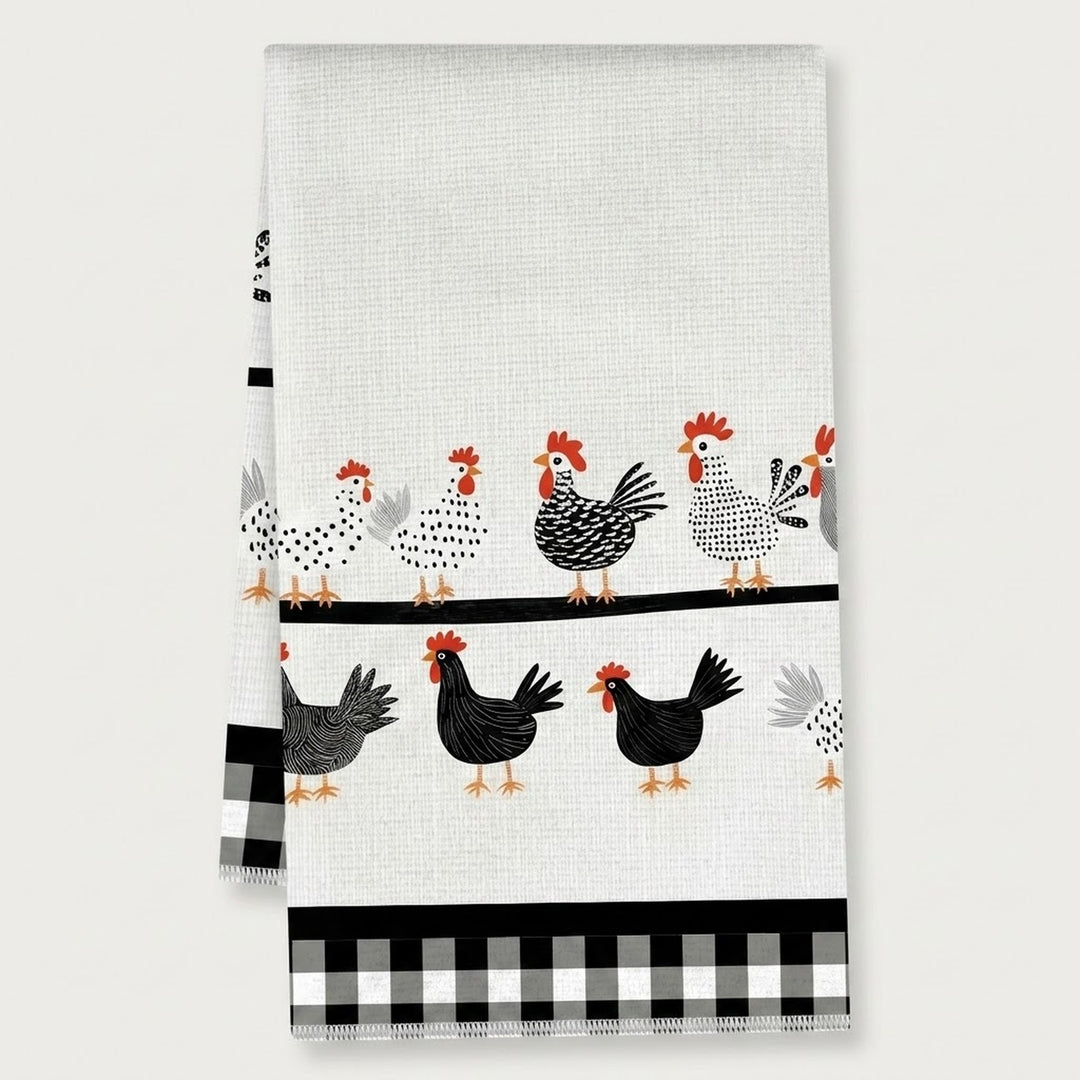 A white kitchen tea towel featuring a pattern of black, white, and red chickens, with a black and white gingham checkered border at the bottom.