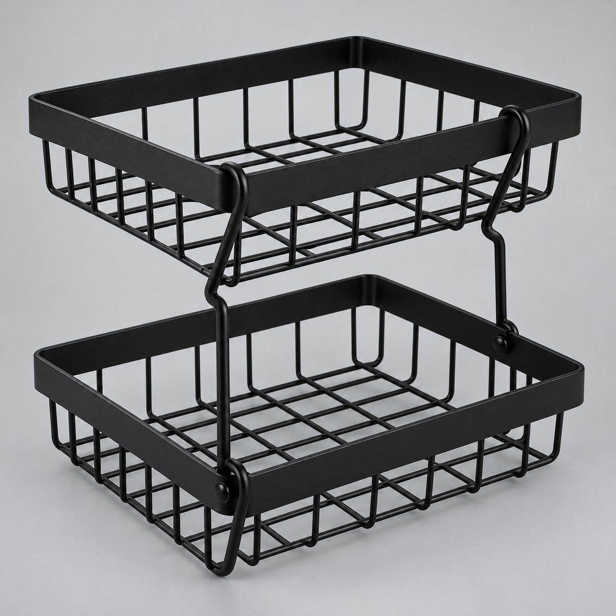 Black Two-Tier Produce Basket stands assembled against a soft gray studio backdrop.