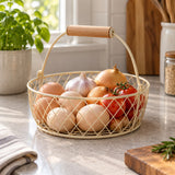 Beige Wire Basket with Wooden Grip gathers eggs and produce on a kitchen counter.