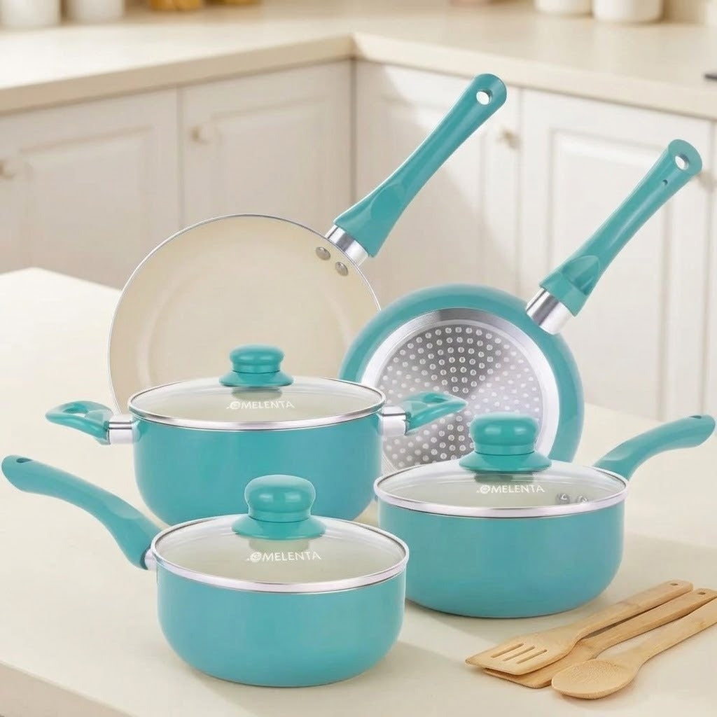 A 5-piece MELLiTA non-stick cookware set in a vibrant turquoise blue, displayed on a light beige countertop in a bright kitchen setting. The set includes two saucepans with glass lids, one frying pan, one deep pot with a perforated insert, and wooden utensils.