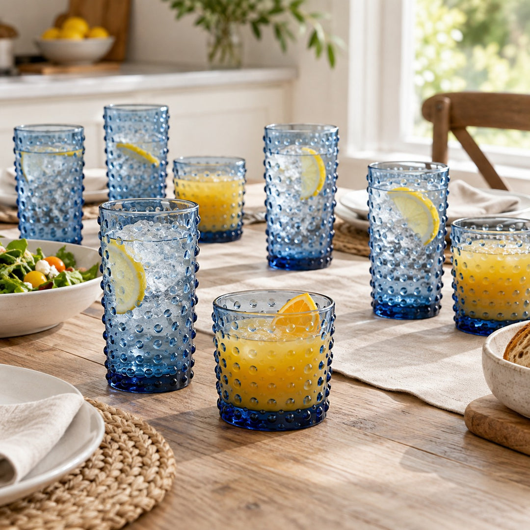 Blue Vintage Hobnail Drinking Glass Set brings matching highball and rocks glasses to a kitchen table.