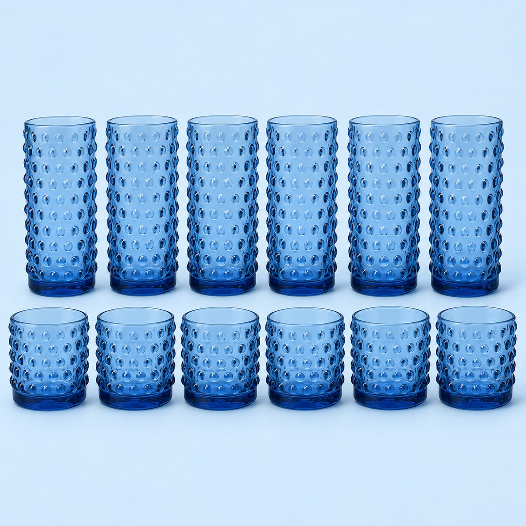 Blue Vintage Hobnail Drinking Glass Set shows twelve matching highball and rocks tumblers on pale blue.