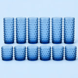 Blue Vintage Hobnail Drinking Glass Set shows twelve matching highball and rocks tumblers on pale blue.