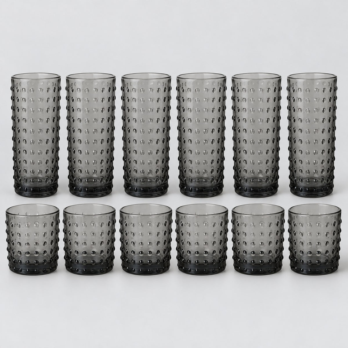 Gray Vintage Hobnail Drinking Glass Set shows twelve matching highball and rocks tumblers on pale gray.