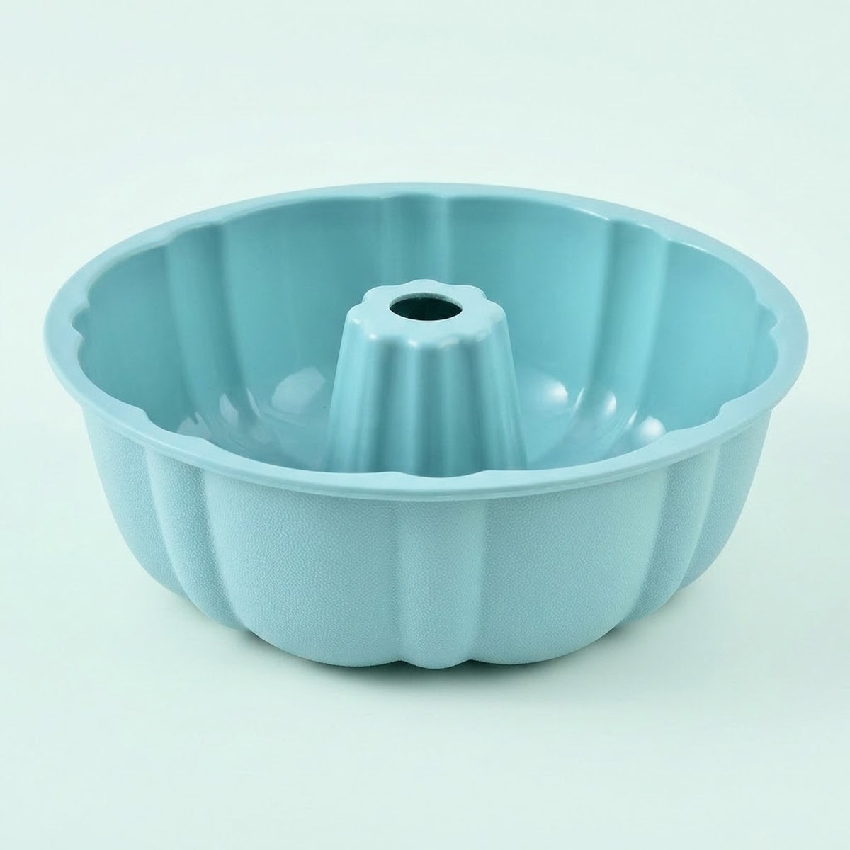 A light blue fluted bundt cake pan with a central tube, shown on a clean white background.