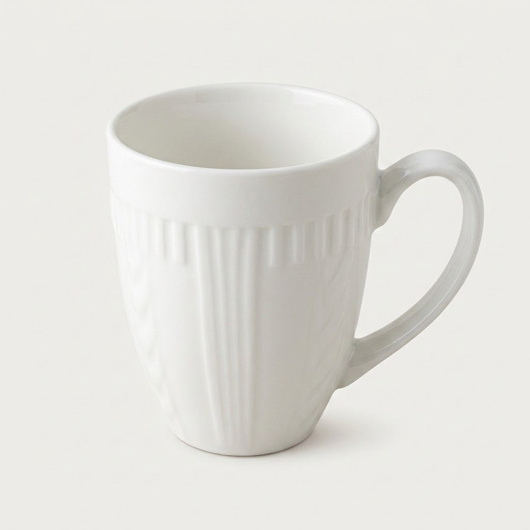 A white ceramic coffee mug with a ribbed vertical texture and a curved handle, shown on a light gray background.