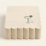 A stack of square off-white paper napkins with scalloped edges, each printed with a black cocktail glass illustration and the words 'Oscar the 2nd' on a light cream background.