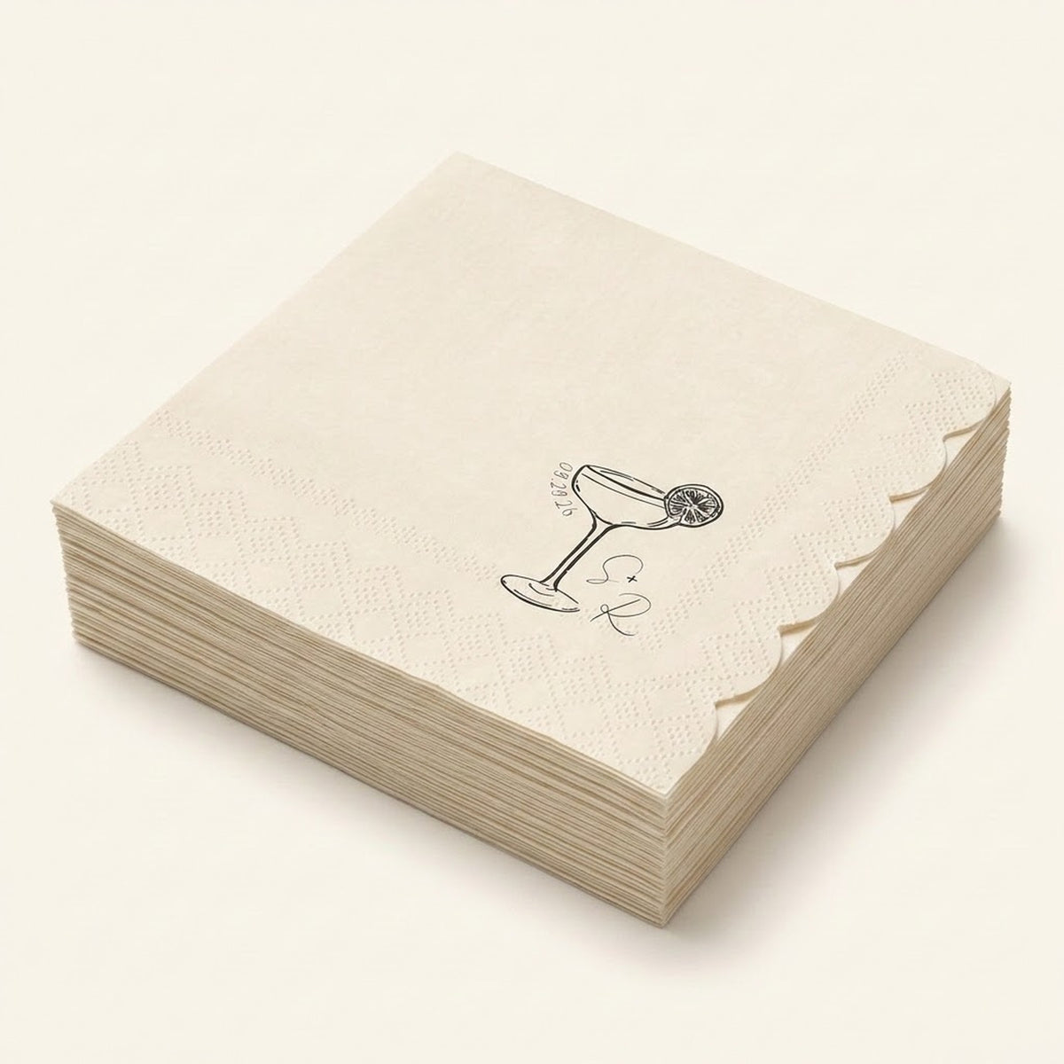 A stack of square cream-colored paper napkins with scalloped edges, featuring a black line art illustration of a martini glass with a lemon wheel garnish and the text 'SIR RICHARD' printed on the top napkin.