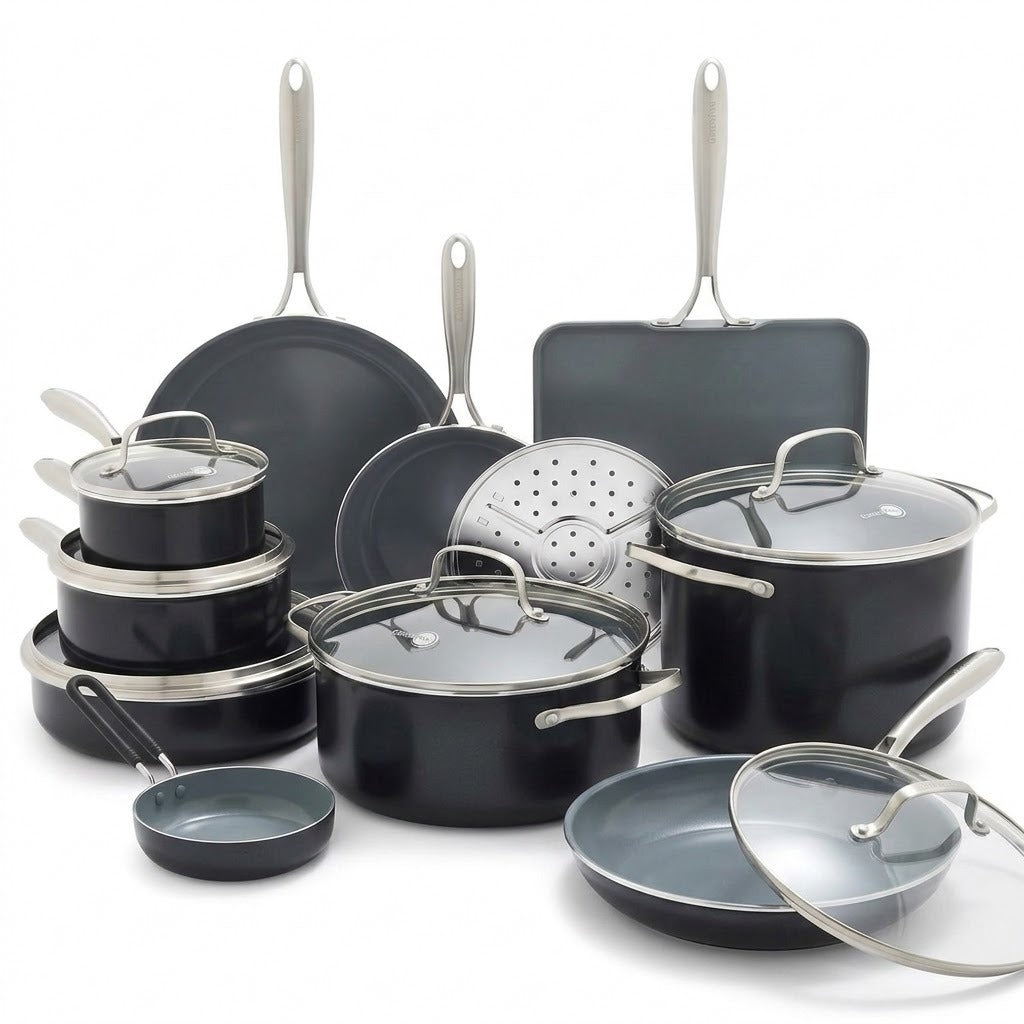 A 16-piece nonstick cookware set in matte black with stainless steel handles and glass lids, arranged on a clean white background.
