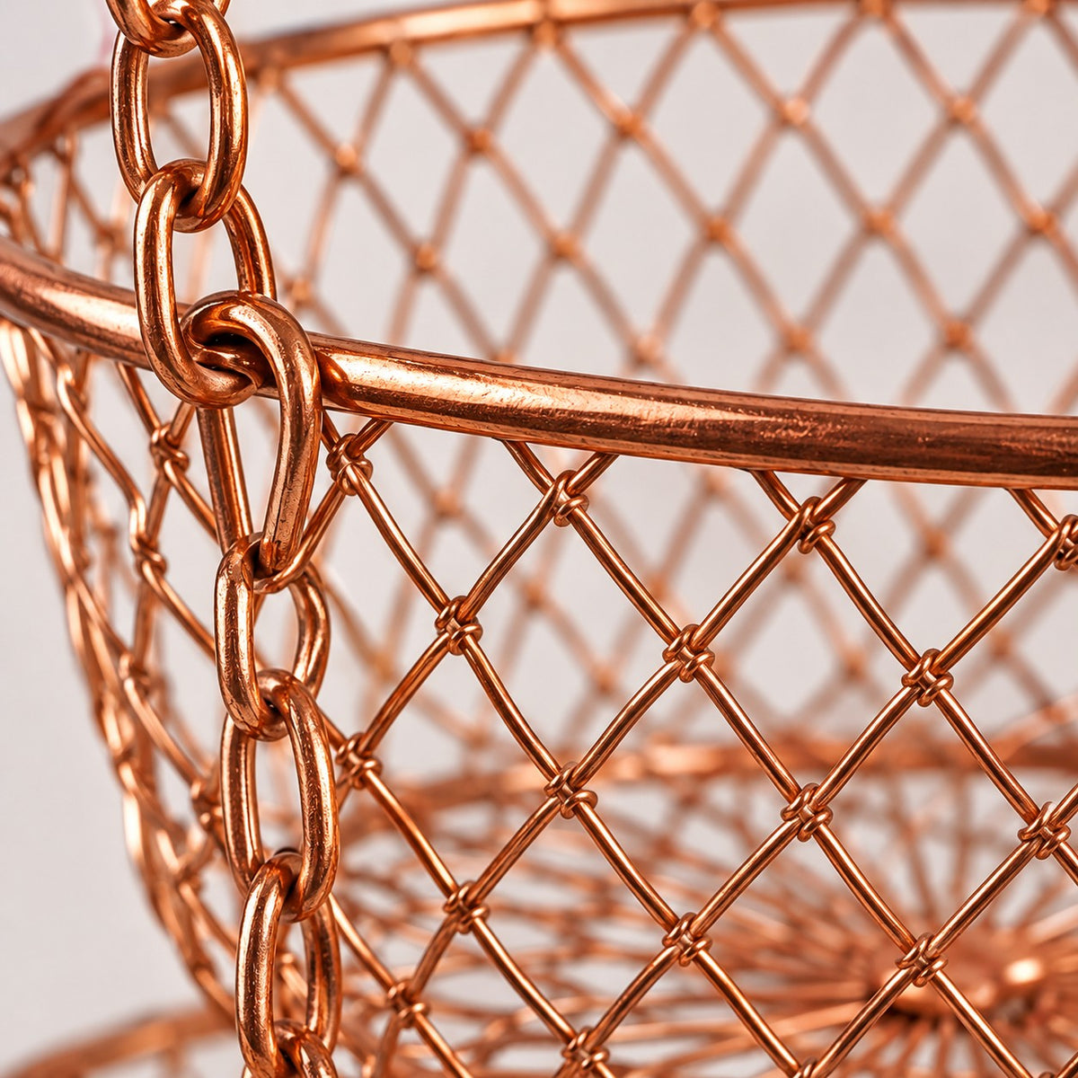 Copper Three Tier Hanging Fruit Basket close-up shows its metal wire mesh and rounded rim.