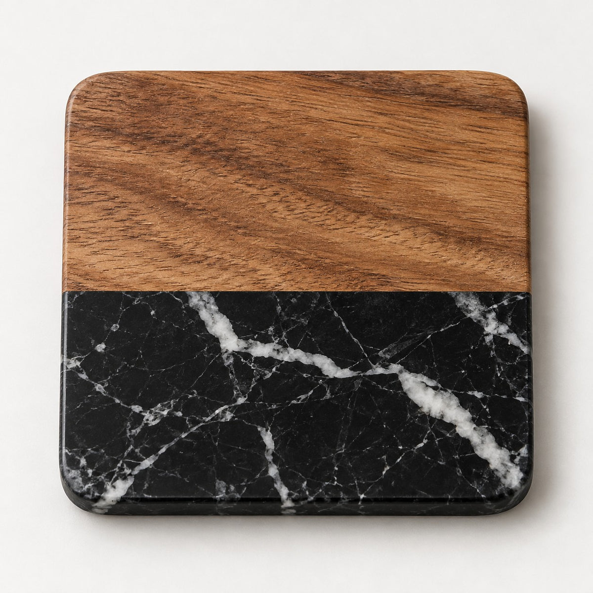 Black Square acacia wood and black marble coaster with rounded corners on a pale backdrop.