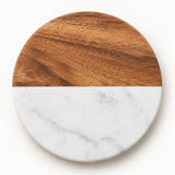 White Round coaster combines natural acacia wood and pale veined marble on a soft white backdrop.
