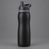 Black 24 oz insulated straw bottle centered against a soft charcoal studio background.