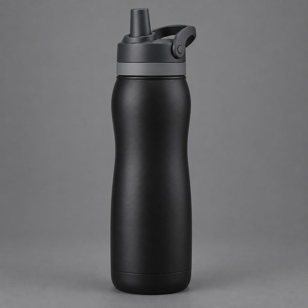 Black 24 oz insulated straw bottle centered against a soft charcoal studio background.