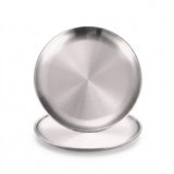 Two round brushed stainless steel plates or shallow pans stacked slightly offset on a clean white background.